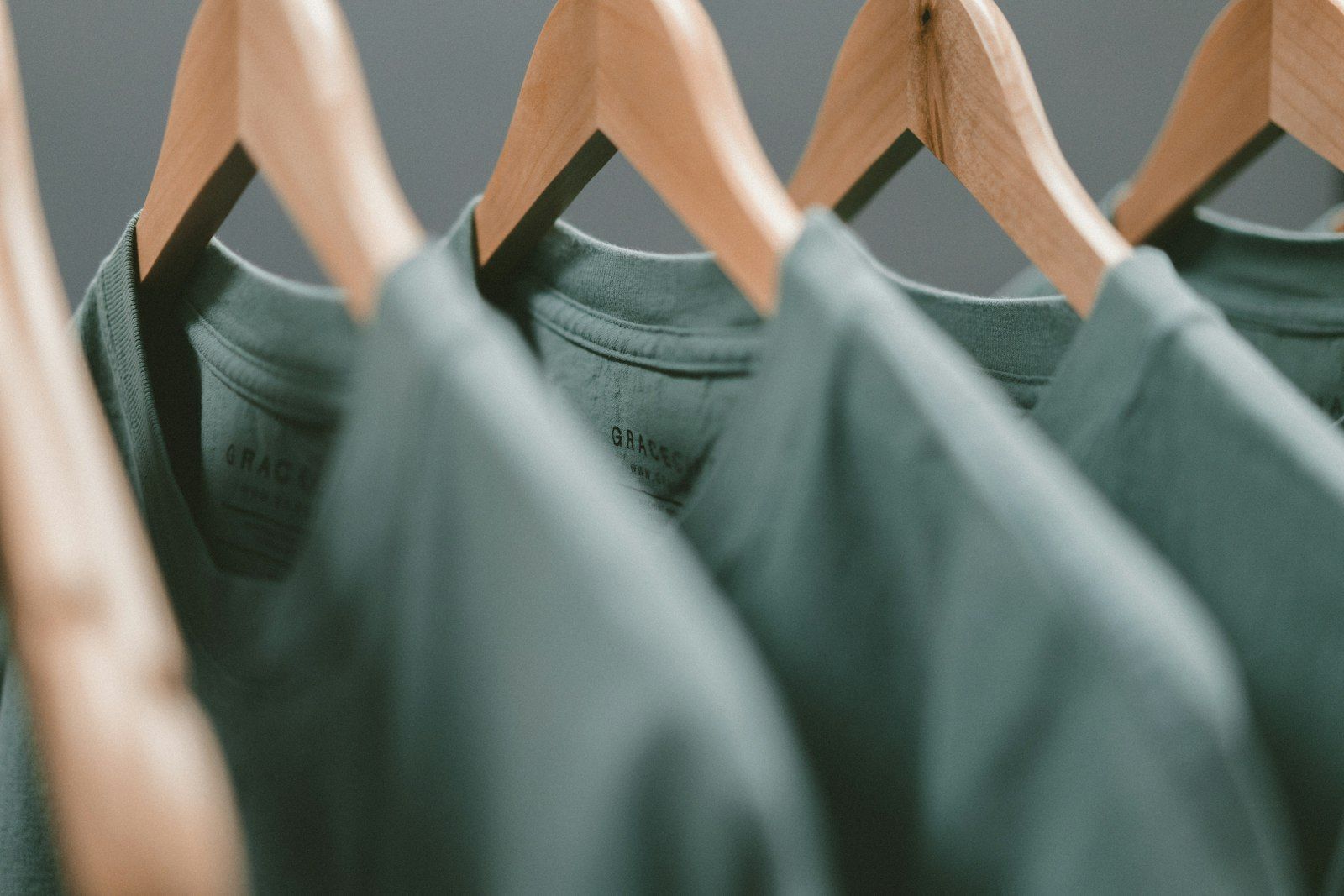 T-shirts on wooden hangers