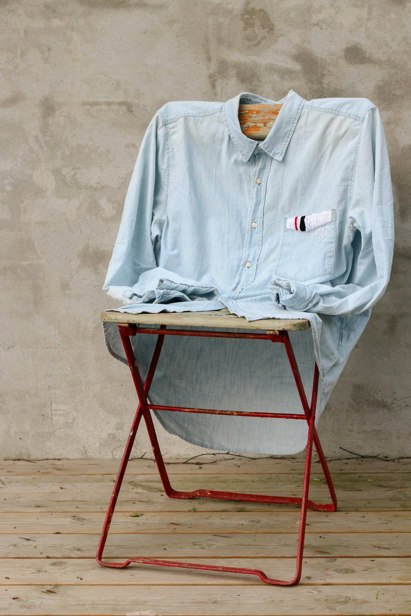 Denim shirt draped over a stool